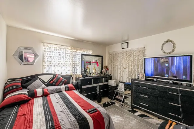 a large white kitchen with a large window