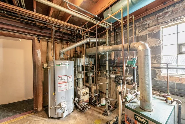 a car parked in front of a brick building