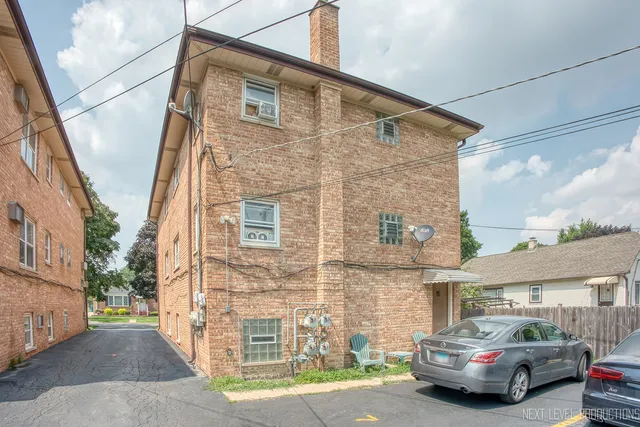 a front view of a building with a street