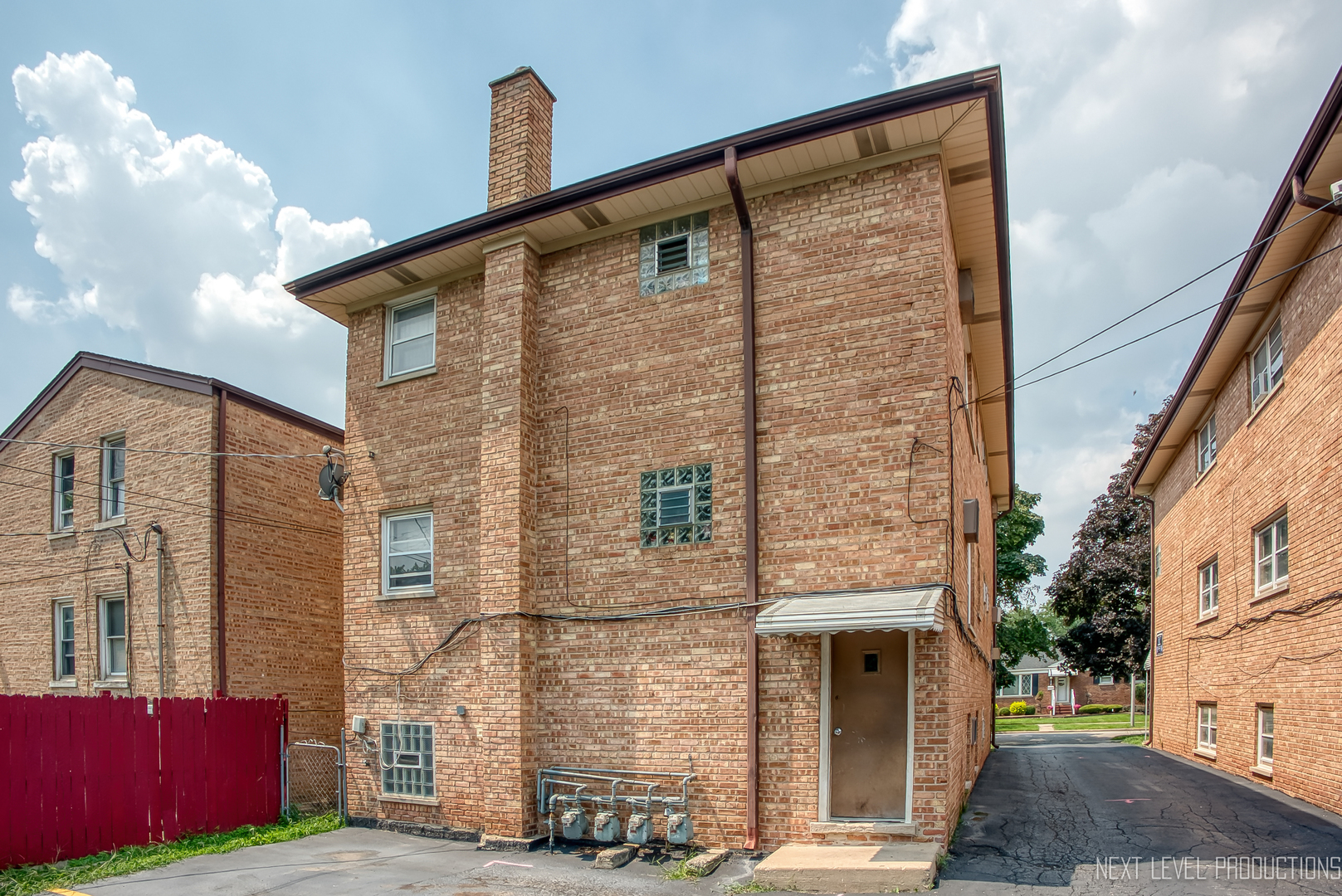 1617 35th Avenue Melrose Park, IL 60160 - Photo 33 of 38 a front view of a building with a street