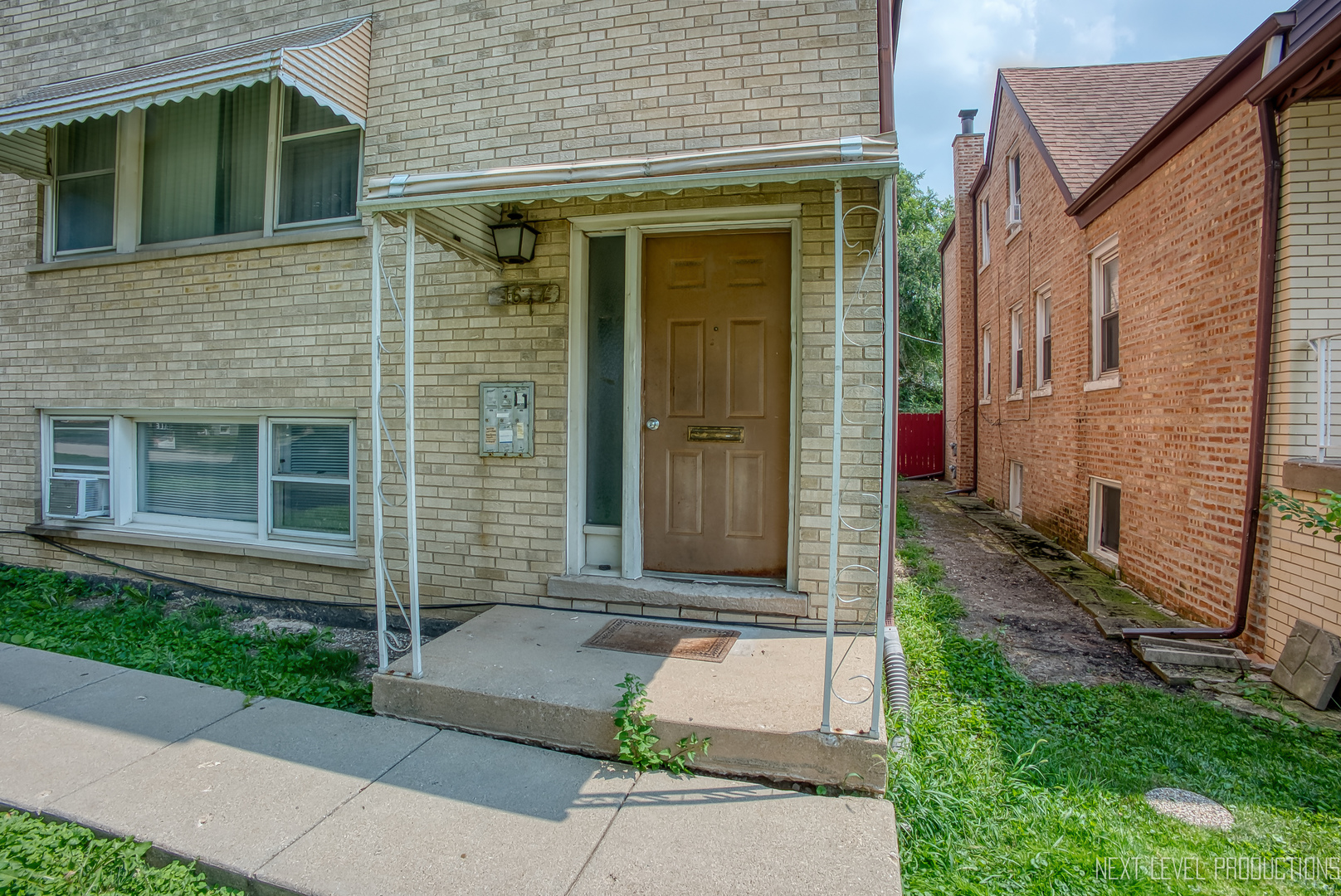 1617 35th Avenue Melrose Park, IL 60160 - Photo 4 of 38 a front view of a house with a garden