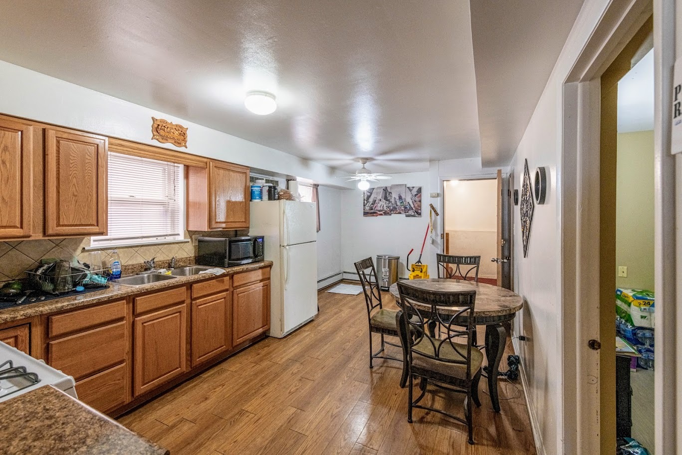 1617 35th Avenue Melrose Park, IL 60160 - Photo 9 of 38 a kitchen with a table chairs stove and refrigerator
