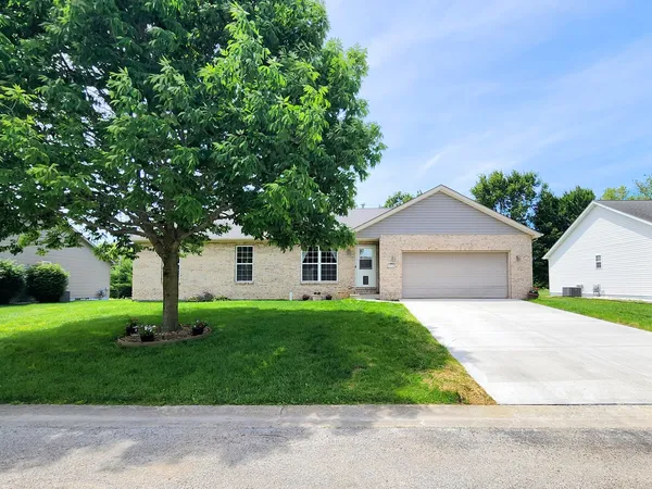 front view of a house with a yard