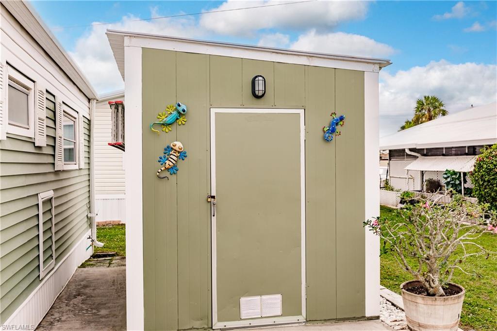 10100 Burnt Store Road, Unit 104 Punta Gorda, FL 33950 - Photo 27 of 46 Shed and laundry area