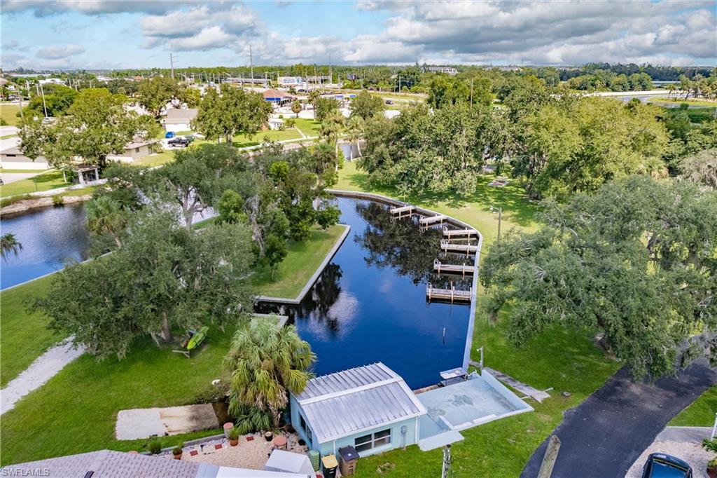 10100 Burnt Store Road, Unit 104 Punta Gorda, FL 33950 - Photo 33 of 46 Aerial view of community dockhouse and marina
