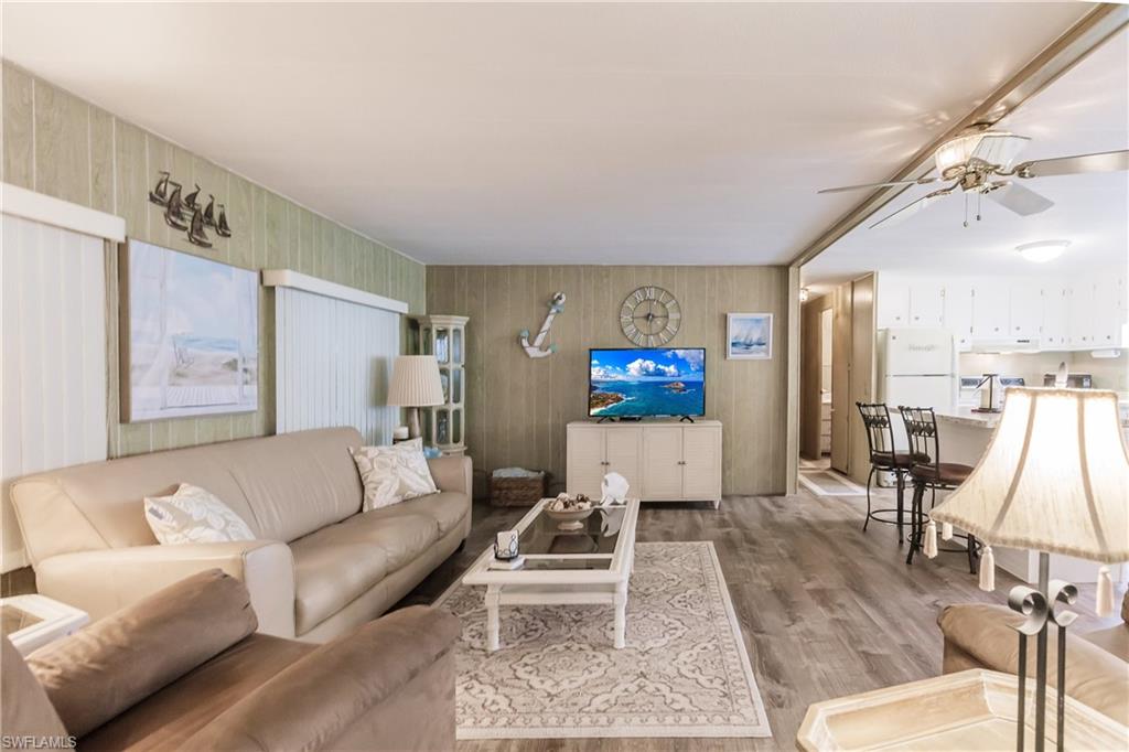 Living room featuring and luxury vinyl plank flooringand ceiling fan