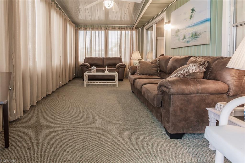 10100 Burnt Store Road, Unit 104 Punta Gorda, FL 33950 - Photo 9 of 46 Carpeted Florida room featuring ceiling fan