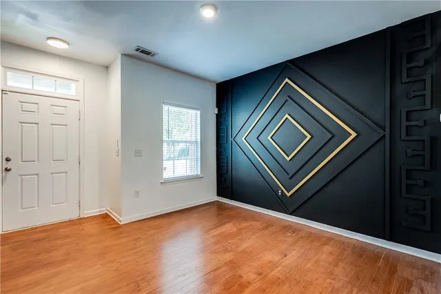 a bathroom with a sink mirror and toilet