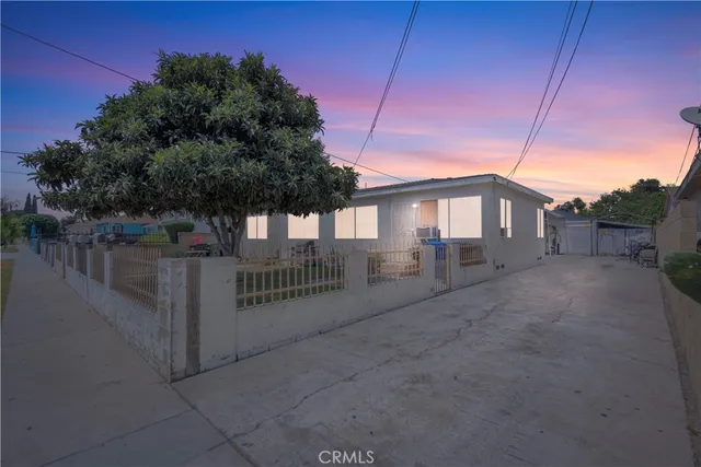 a view of a house with a small yard