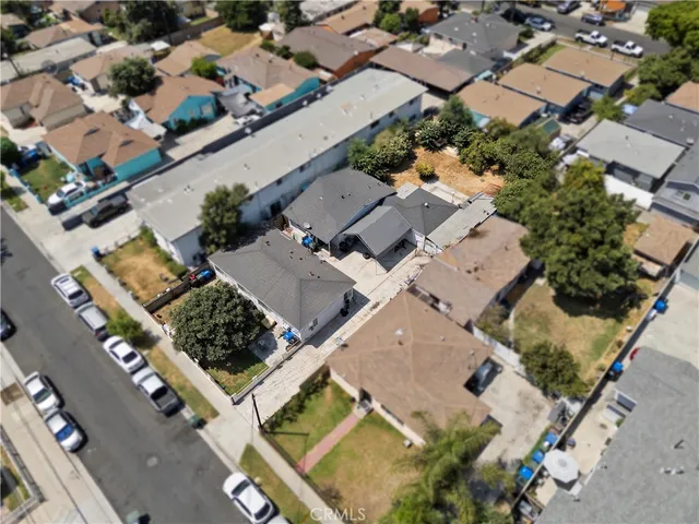 an aerial view of a house with a yard
