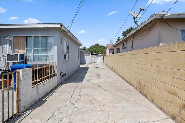 a view of backyard of house with wooden floor
