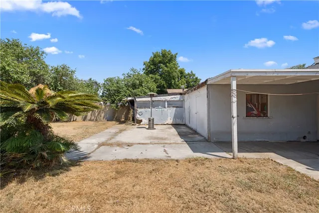a backyard of a house with a yard and garage