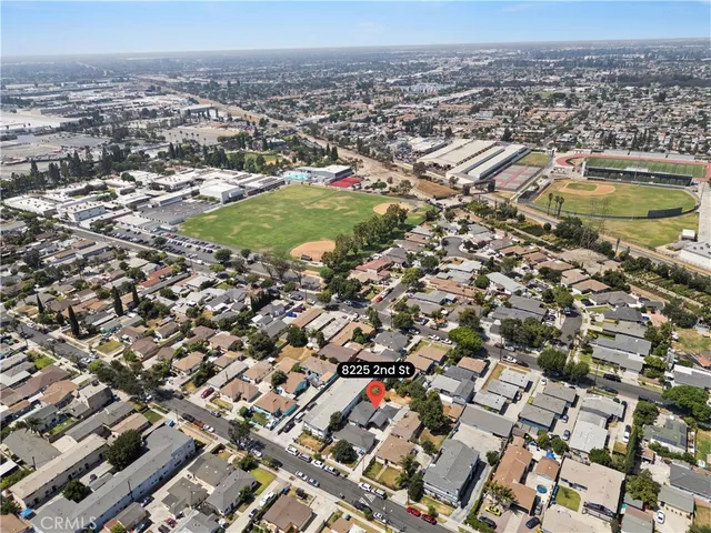 an aerial view of residential houses with city view