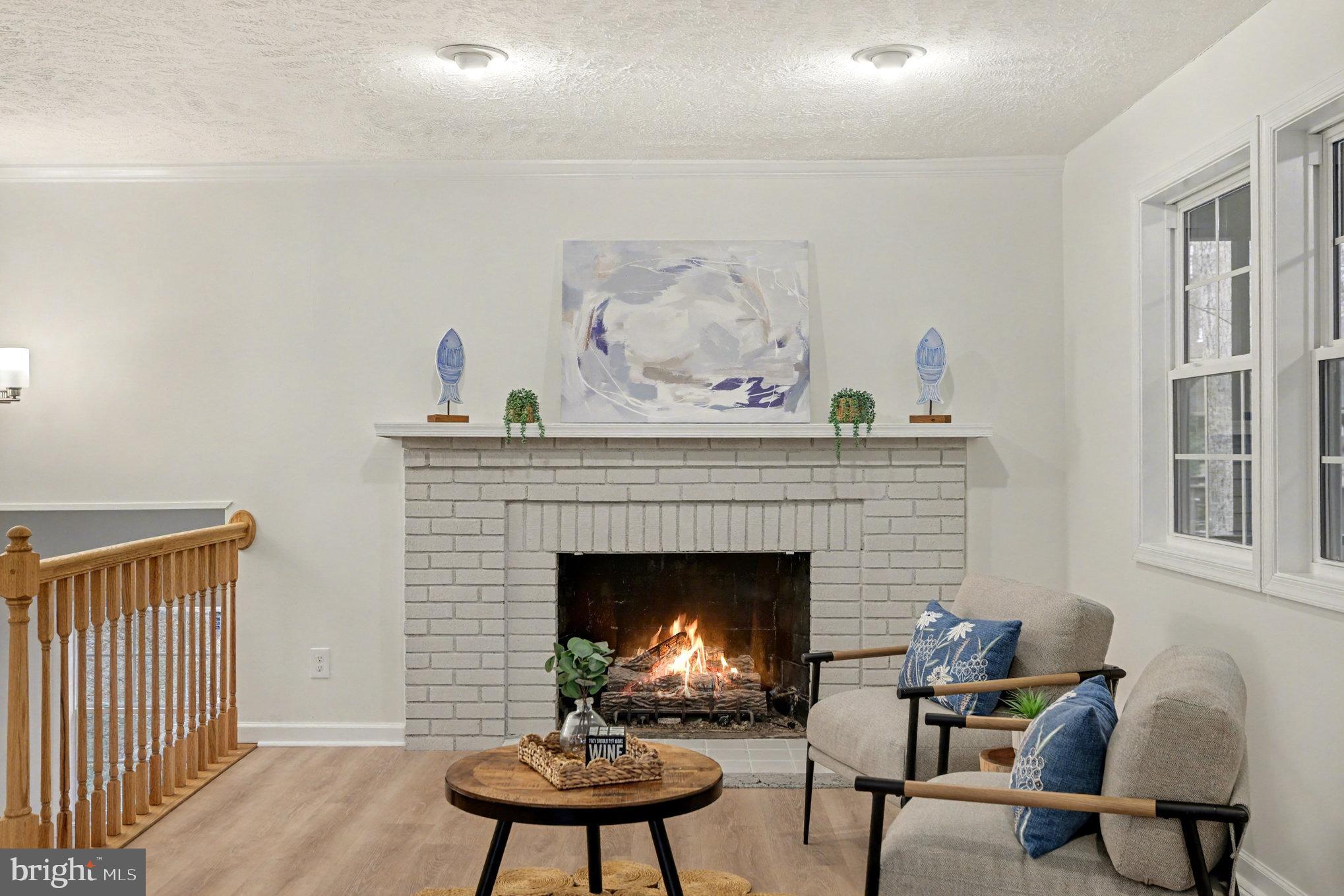 305 Green Street Locust Grove, VA 22508 - Photo 12 of 25 a living room with furniture and a fireplace
