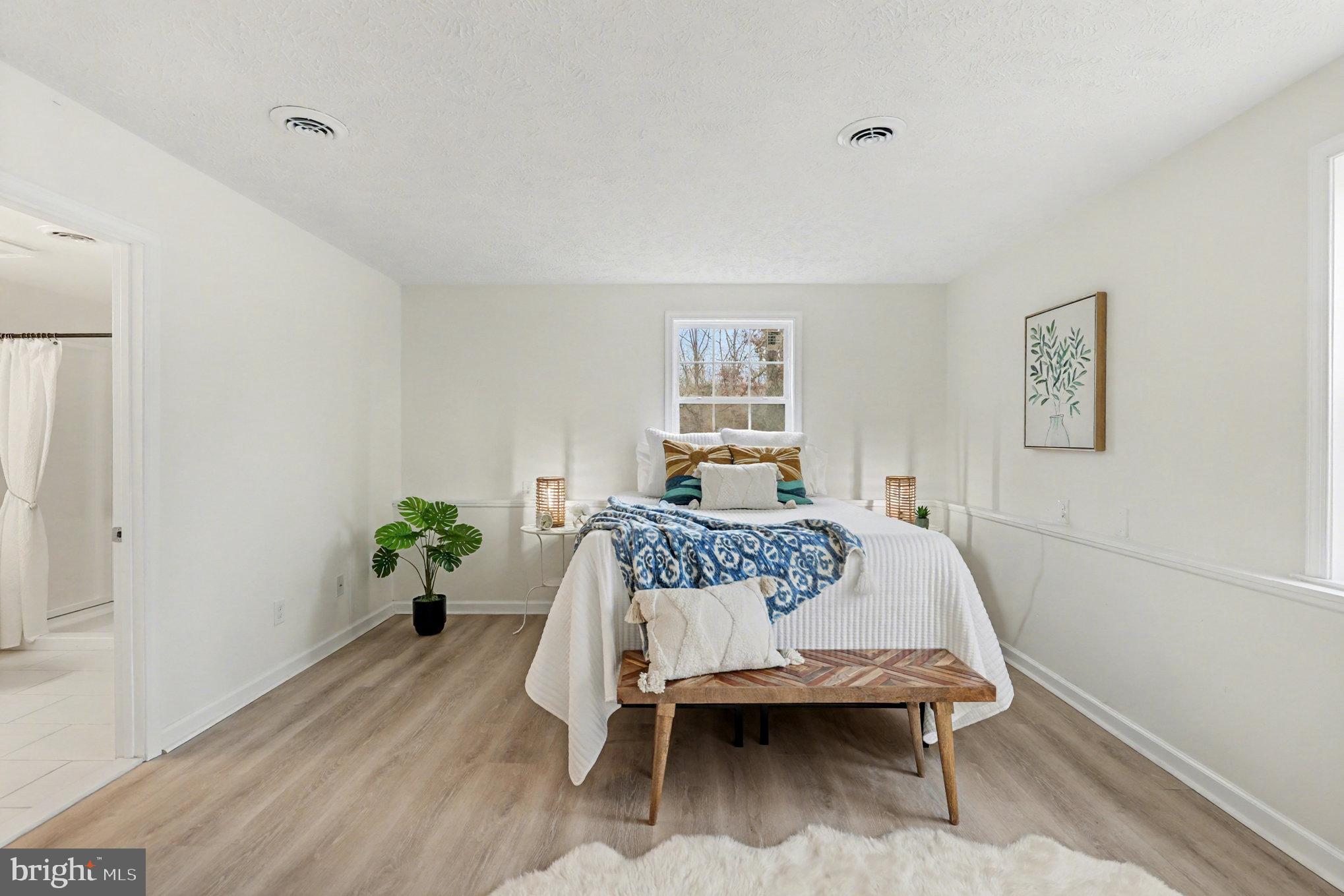 305 Green Street Locust Grove, VA 22508 - Photo 16 of 25 a bedroom with a bed and wooden floor