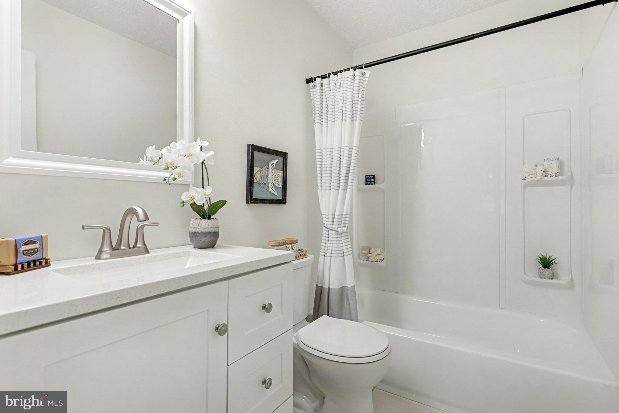 305 Green Street Locust Grove, VA 22508 - Photo 18 of 25 a bathroom with a sink toilet and shower
