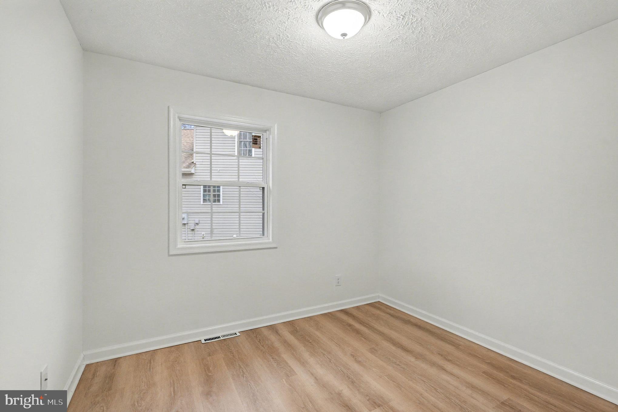 305 Green Street Locust Grove, VA 22508 - Photo 23 of 25 an empty room with a window