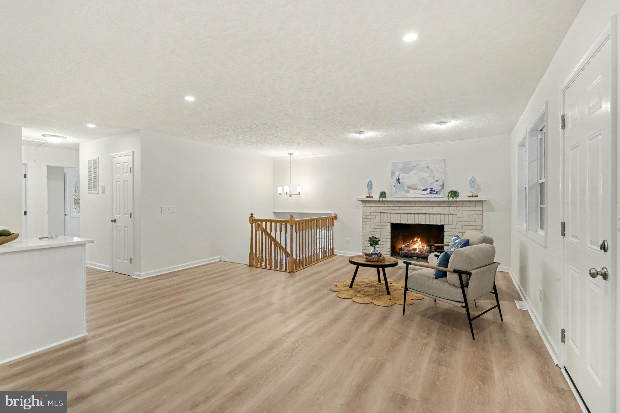 305 Green Street Locust Grove, VA 22508 - Photo 10 of 25 a view of a livingroom with a fireplace and furniture