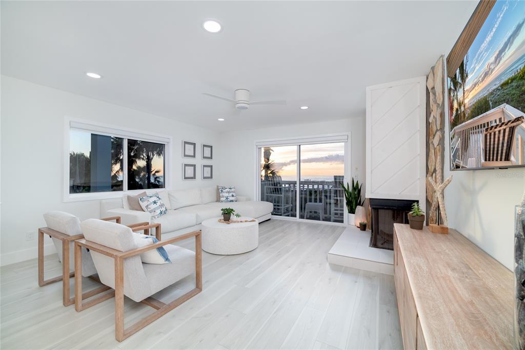 1104 Beach Trail, Unit 1 Indian Rocks Beach, FL 33785 - Photo 2 of 24 a living room with furniture and a large window