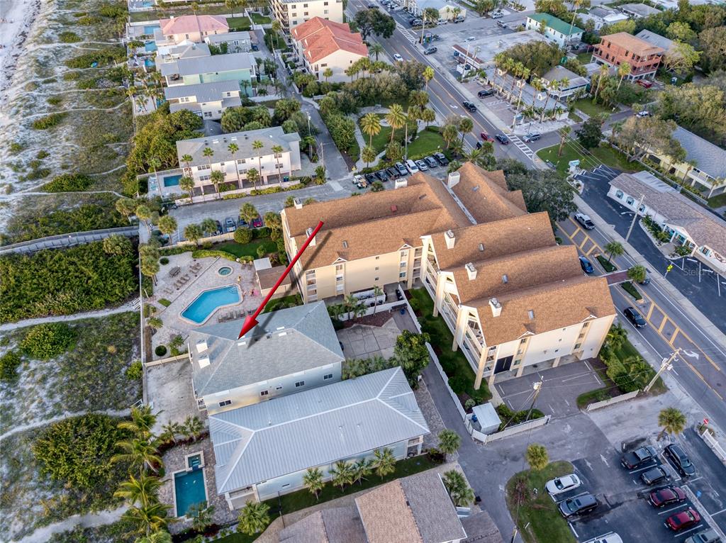 1104 Beach Trail, Unit 1 Indian Rocks Beach, FL 33785 - Photo 21 of 24 an aerial view of a houses with yard
