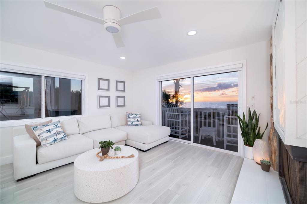 1104 Beach Trail, Unit 1 Indian Rocks Beach, FL 33785 - Photo 6 of 24 a living room with furniture and a large window