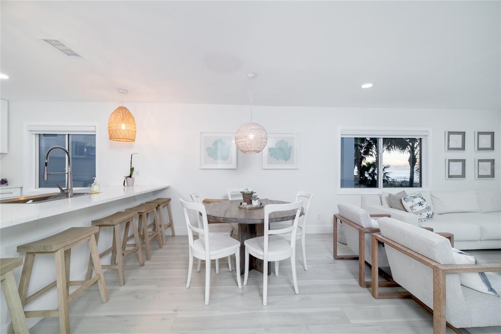 1104 Beach Trail, Unit 1 Indian Rocks Beach, FL 33785 - Photo 8 of 24 a view of a dining room with furniture and wooden floor