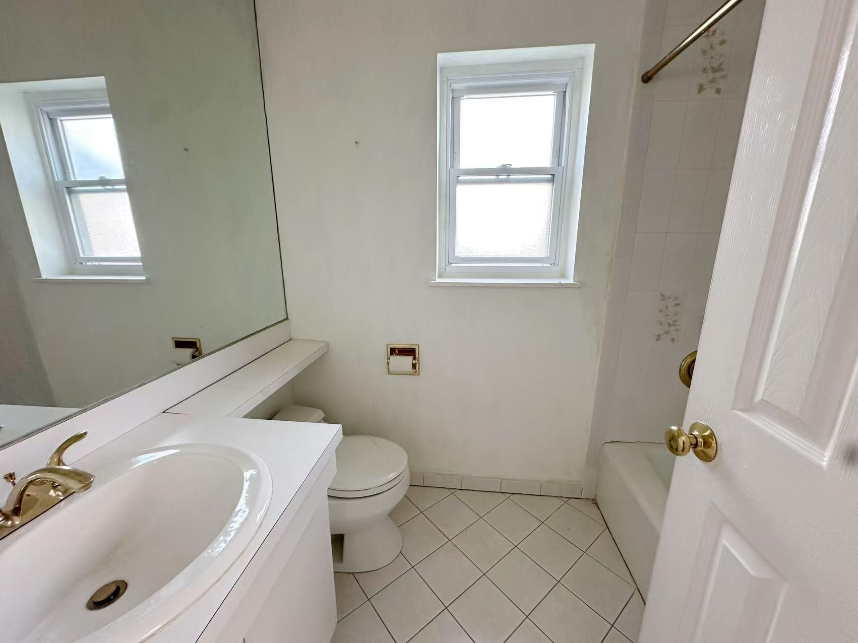23-11 Whitestone Expressway Queens, NY 11357 - Photo 4 of 10 a bathroom with a sink and a bathtub