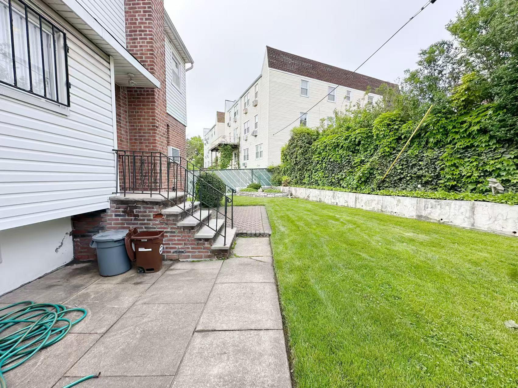 23-11 Whitestone Expressway Queens, NY 11357 - Photo 6 of 10 a view of a back yard of the house