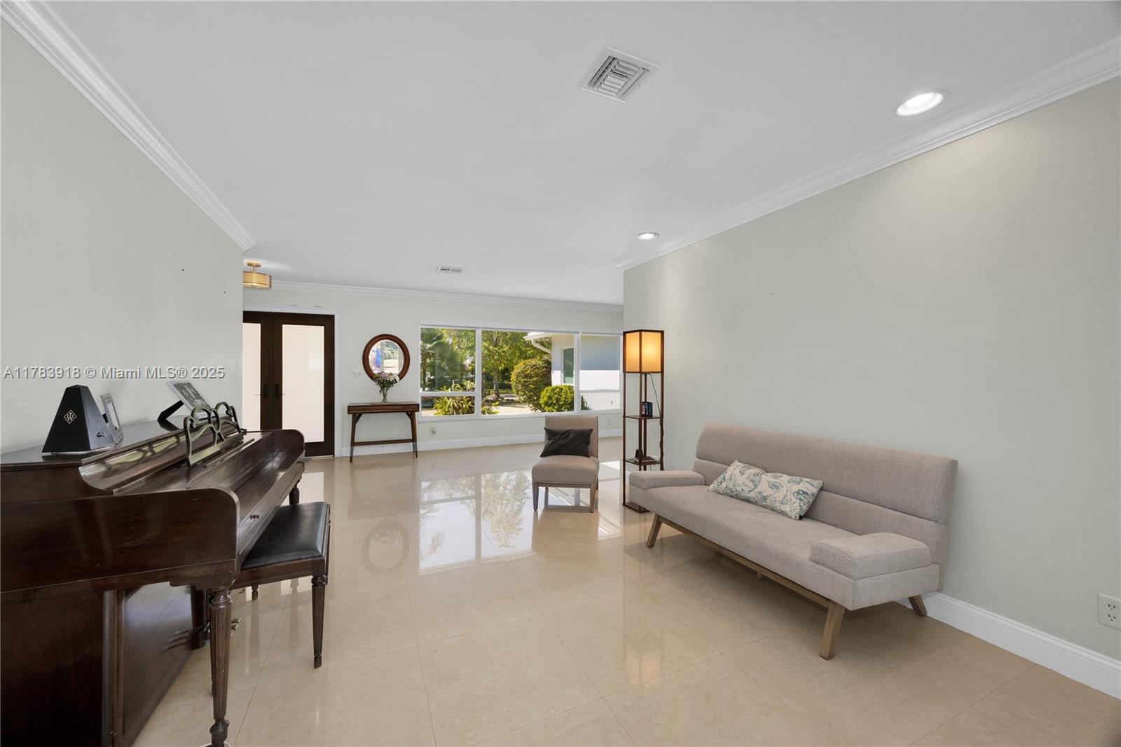 9401 Southwest 69th Court Pinecrest, FL 33156 - Photo 21 of 39 a living room with furniture and window