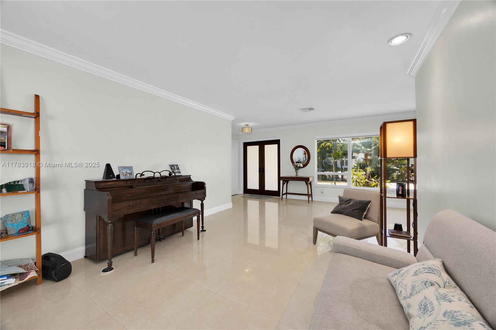 9401 Southwest 69th Court Pinecrest, FL 33156 - Photo 22 of 39 a living room with furniture and a piano
