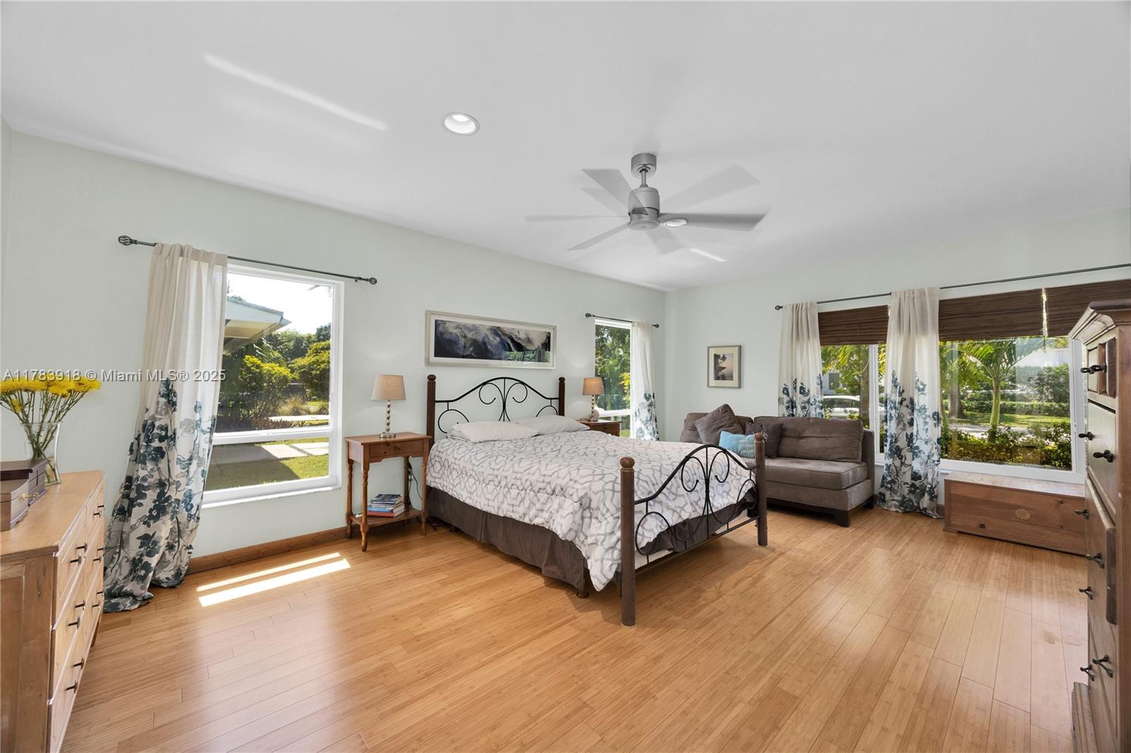 9401 Southwest 69th Court Pinecrest, FL 33156 - Photo 32 of 39 a bedroom with a bed and a large window