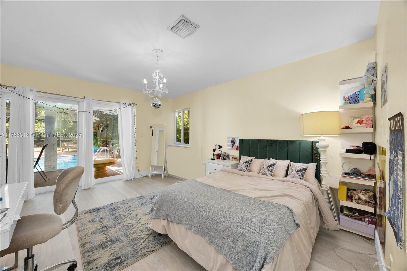 9401 Southwest 69th Court Pinecrest, FL 33156 - Photo 35 of 39 a bedroom with a large bed and a large window