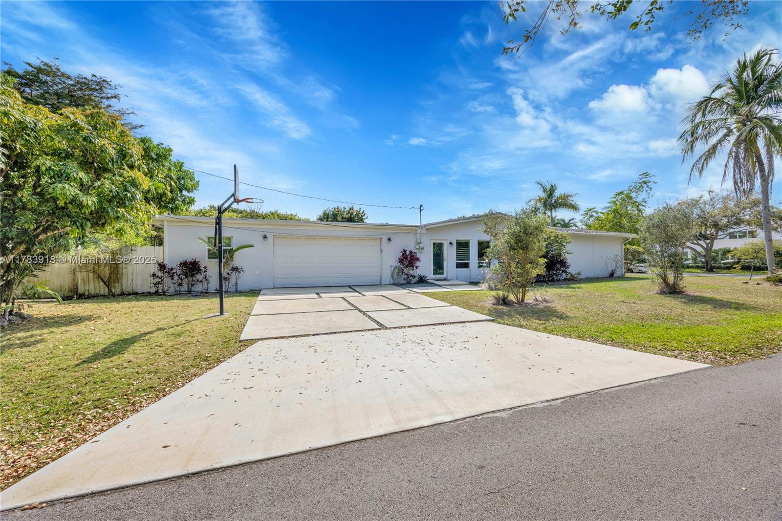 9401 Southwest 69th Court Pinecrest, FL 33156 - Photo 6 of 39 a house view with a backyard space