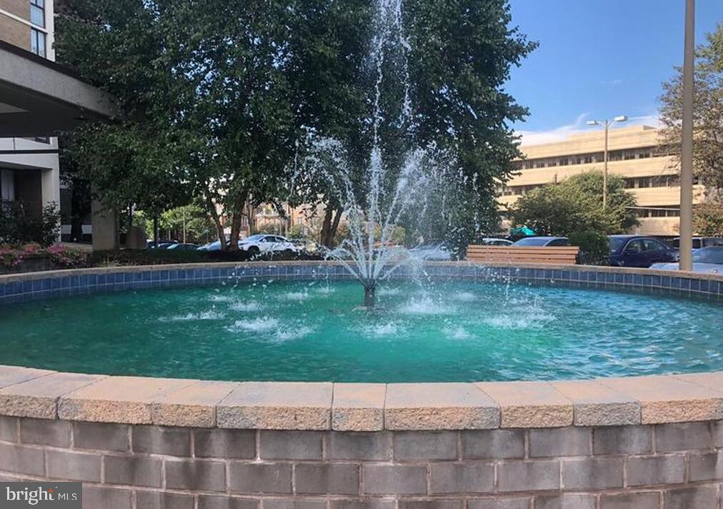 6800 Fleetwood Road, Unit 913 McLean, VA 22101 - Photo 2 of 13 Tranquil fountain in vibrant setting.