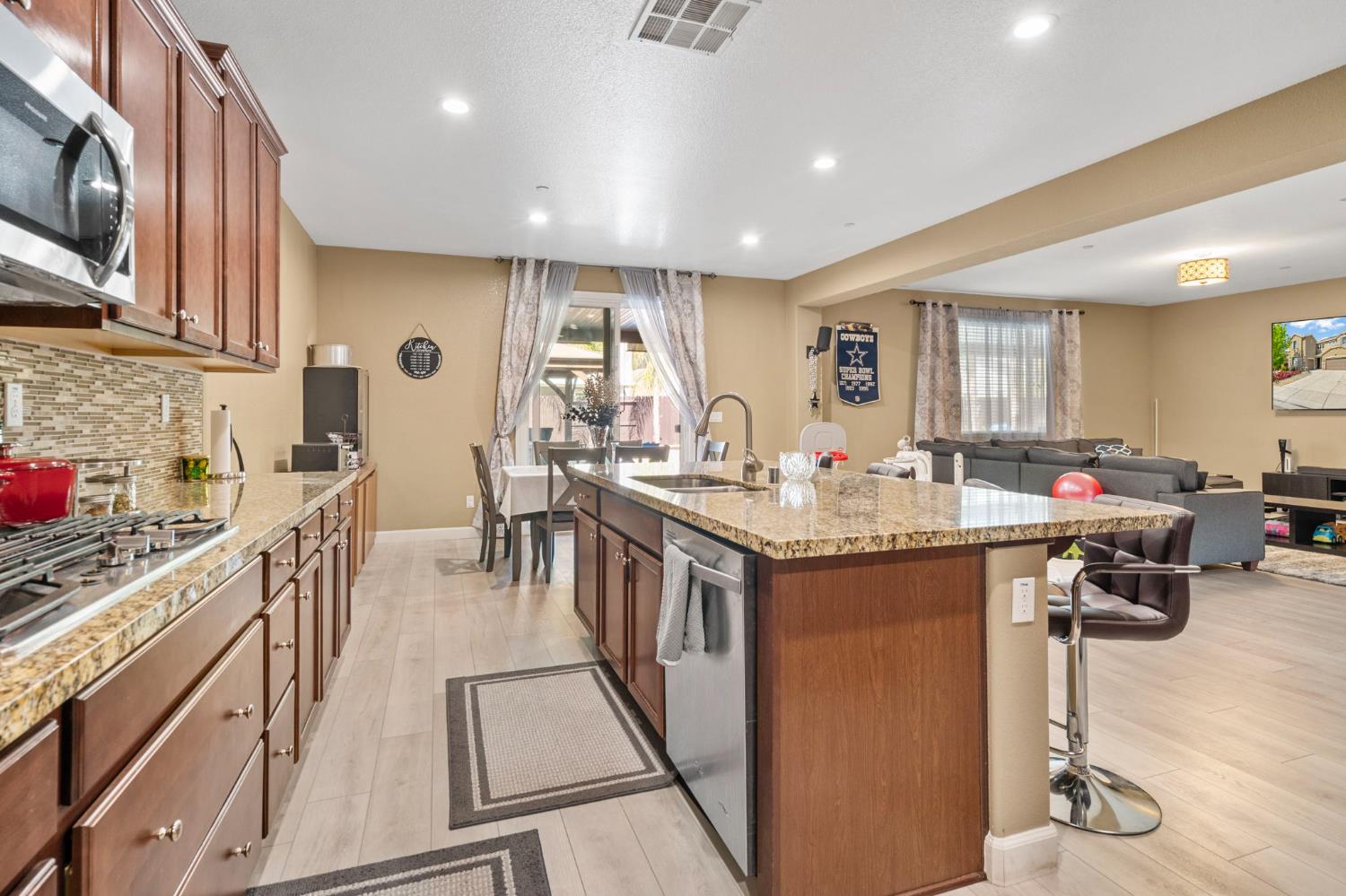 2317 Mathar Drive Manteca, CA 95337 - Photo 16 of 48 a kitchen with counter top space a sink appliances and cabinets