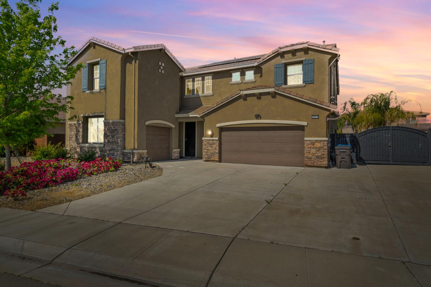 2317 Mathar Drive Manteca, CA 95337 - Photo 2 of 48 a front view of a house with a yard and garage