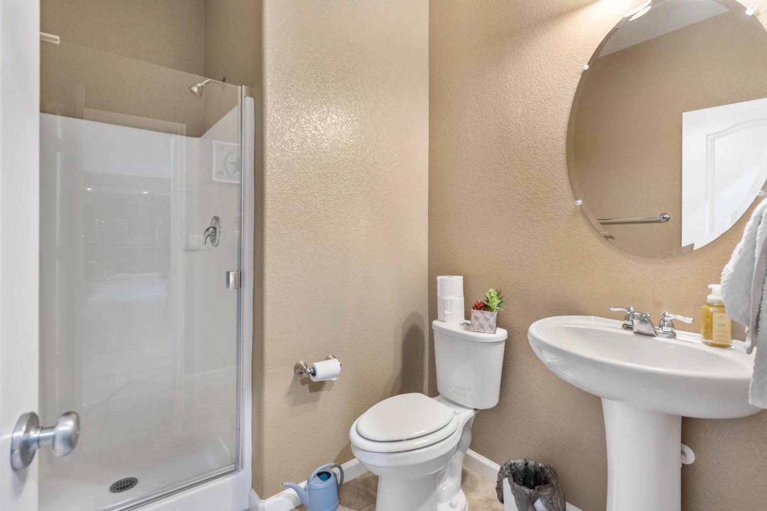 2317 Mathar Drive Manteca, CA 95337 - Photo 22 of 48 a bathroom with a sink toilet and shower