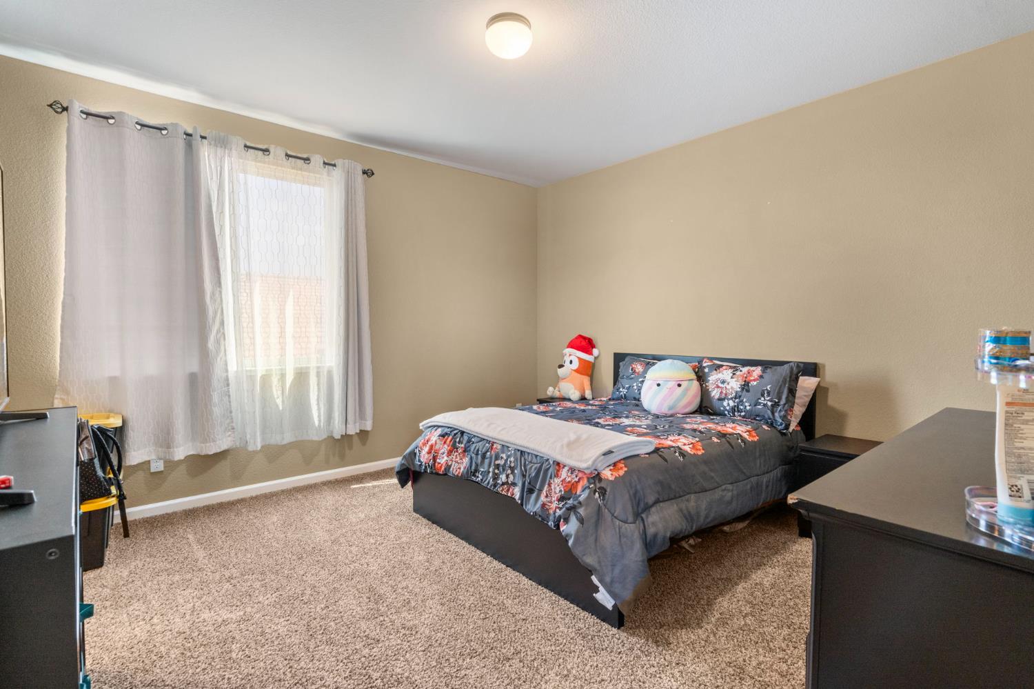 2317 Mathar Drive Manteca, CA 95337 - Photo 25 of 48 a bedroom with a bed and a window