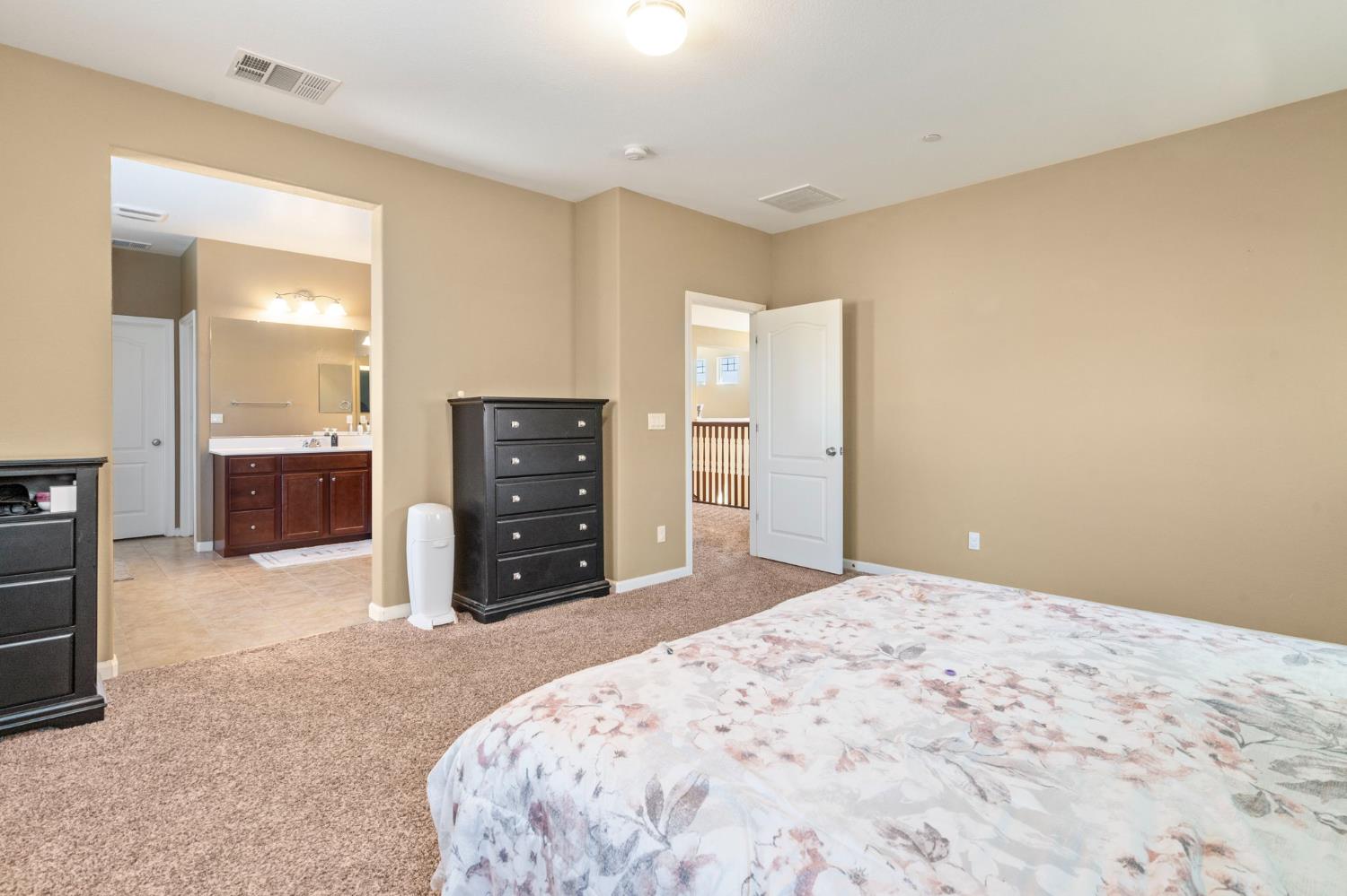 2317 Mathar Drive Manteca, CA 95337 - Photo 30 of 48 a bedroom with a bed and a dresser