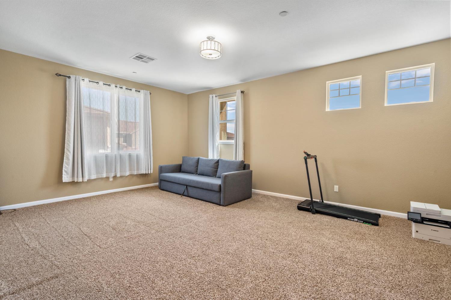 2317 Mathar Drive Manteca, CA 95337 - Photo 37 of 48 a living room with furniture and a window