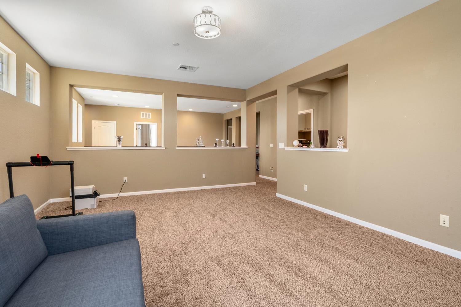 2317 Mathar Drive Manteca, CA 95337 - Photo 38 of 48 a living room with furniture and a window