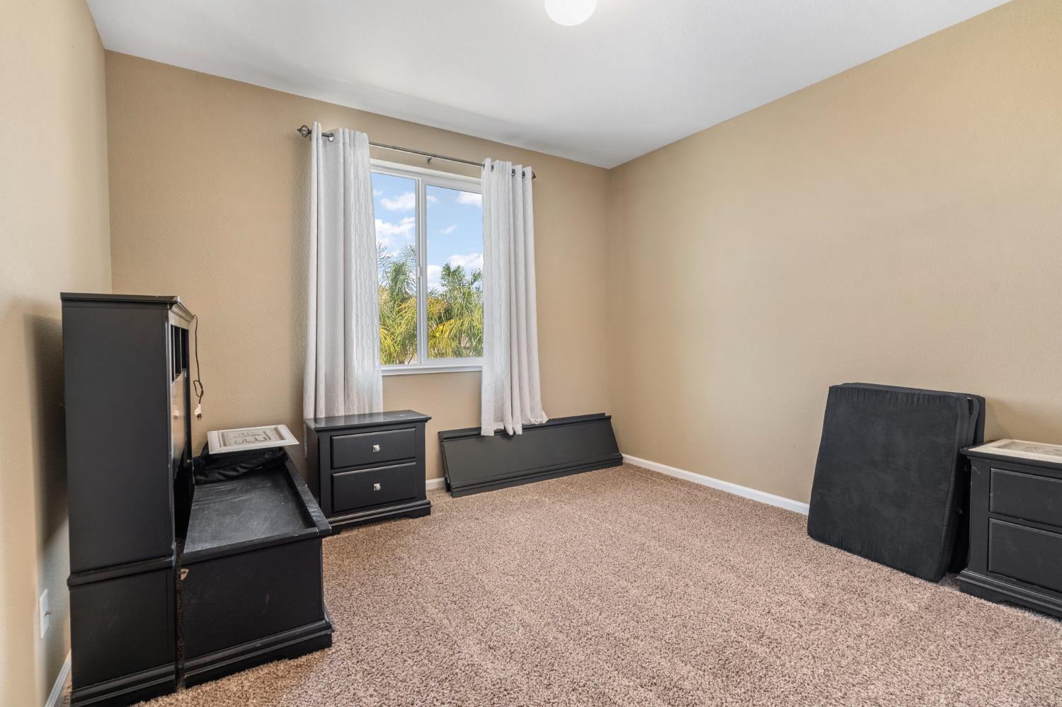 2317 Mathar Drive Manteca, CA 95337 - Photo 40 of 48 a living room with furniture and a window