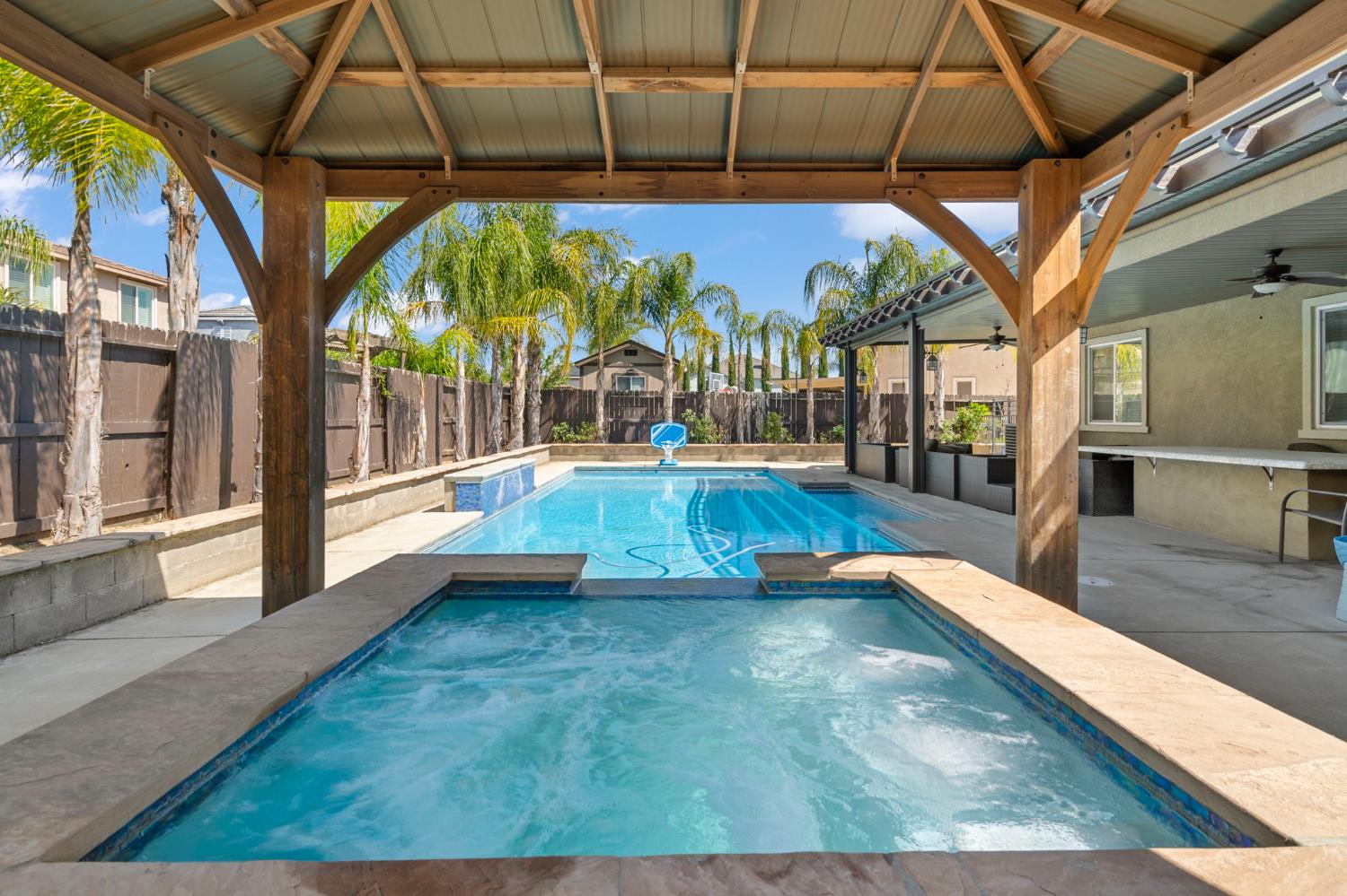 2317 Mathar Drive Manteca, CA 95337 - Photo 43 of 48 a view of a swimming pool with a porch