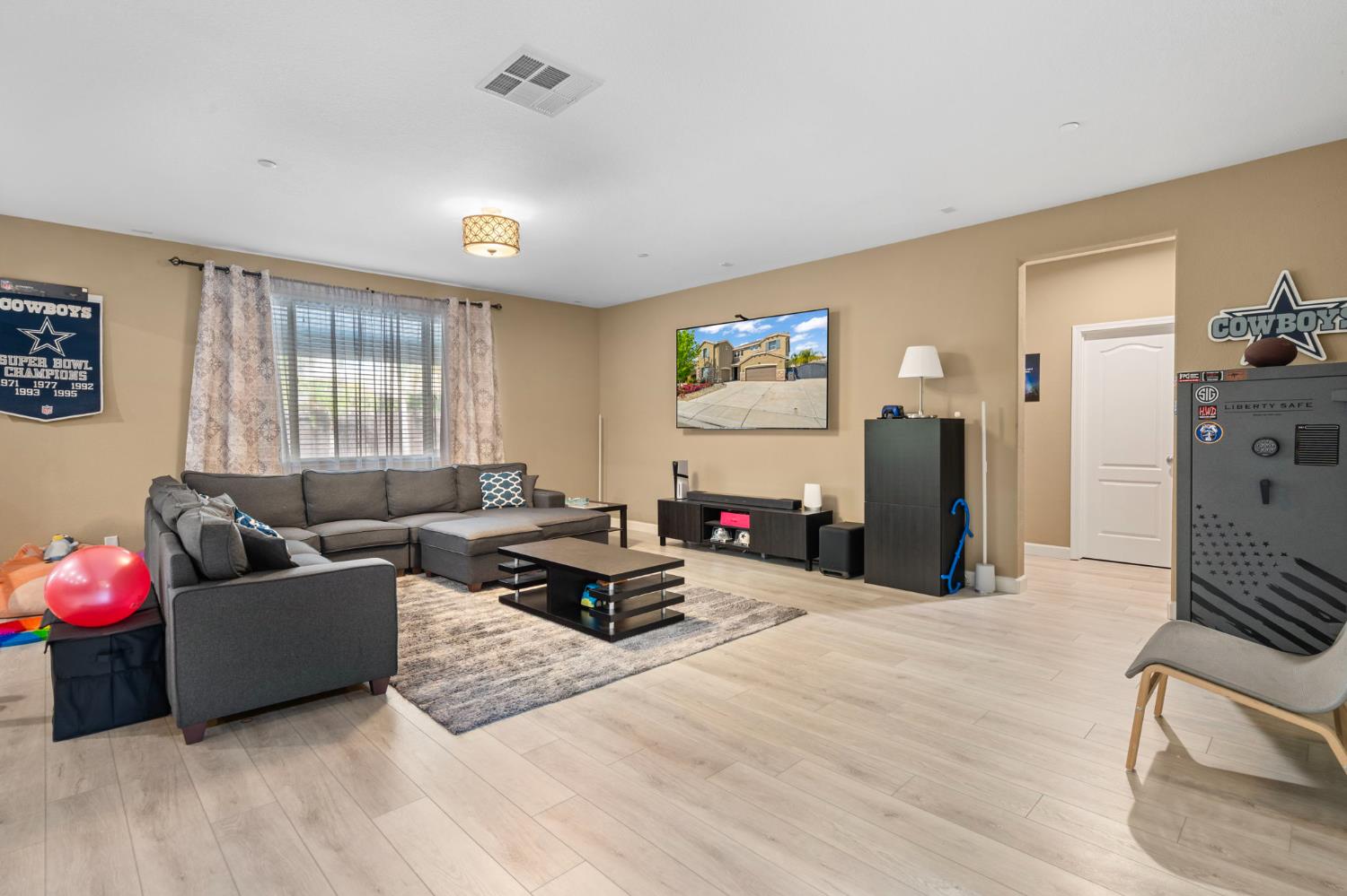 2317 Mathar Drive Manteca, CA 95337 - Photo 8 of 48 a living room with furniture window and a flat screen tv