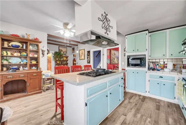 a kitchen that has a lot of cabinets in it