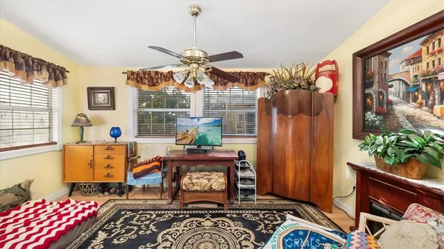 a bedroom with a bed a couch and dresser