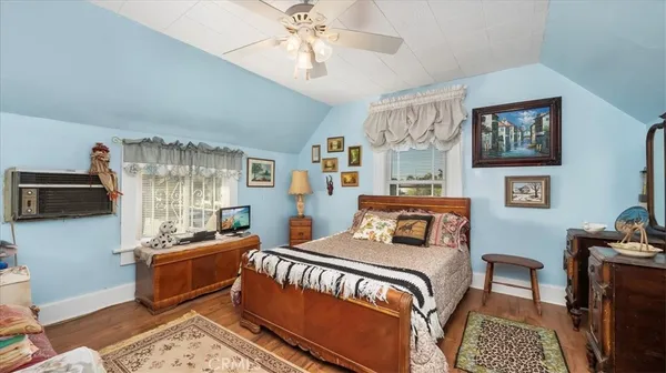 a bed room with a bed and a chair