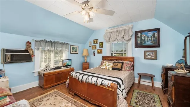 a bed room with a bed and a chair