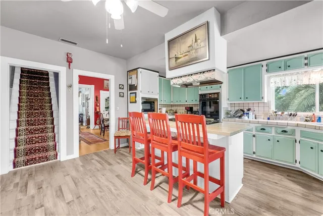 a dining room with furniture and wooden floor