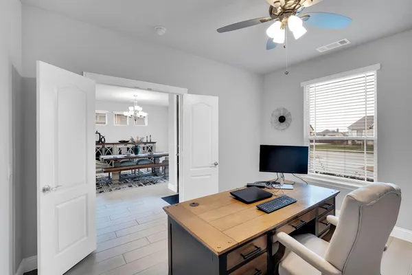 a view of a workspace with furniture